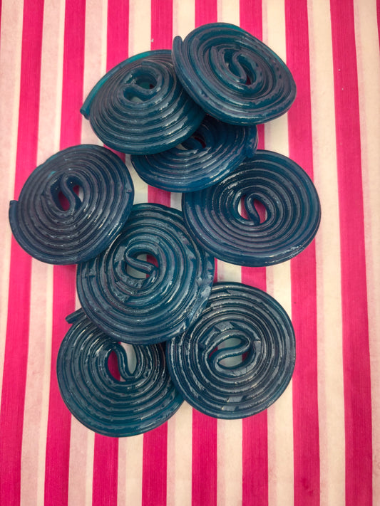 Blue spiral candies on a pink and white striped background